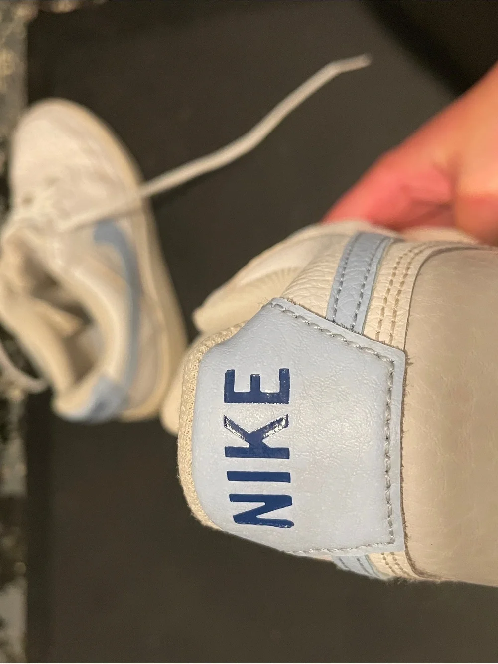 Nike White Low-Top Sneakers with Light Blue Swoosh